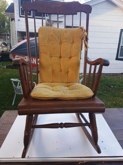 Solid wood rocking chair with cushions