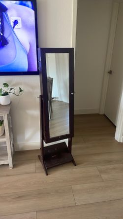 Standing mirror with jewelry organizer