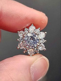 Cubic Zirconia Flower Shaped Sterling Silver Stud Earrings.