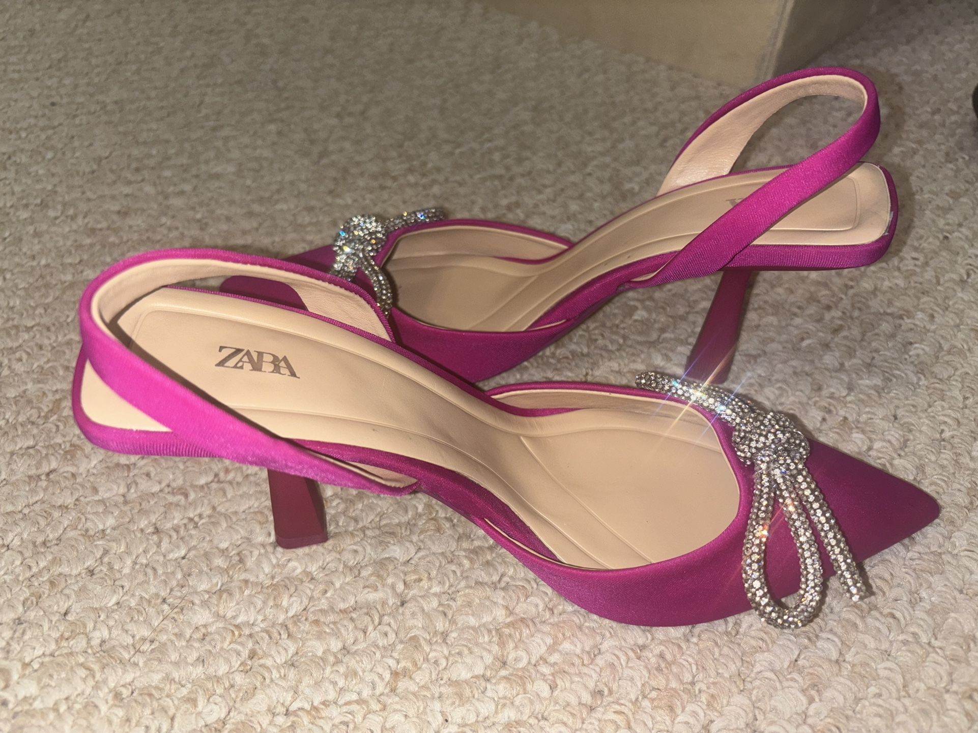 Hot pink heels with silver diamond bow. Never worn. European exclusive. Size 39.