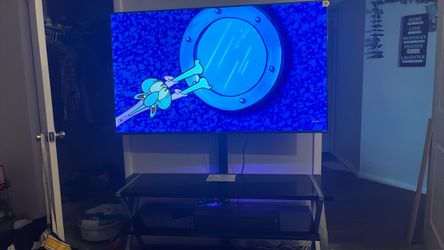 65 in tv with tv stand and speaker with remote