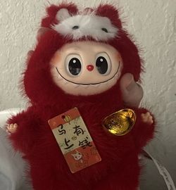 This is a Pop Mart Labubu The Monsters Pin For Love Series mini plush doll in red