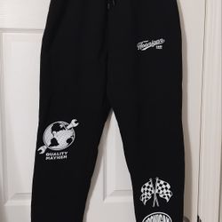 Black sweatpants with Hoonigan graphics