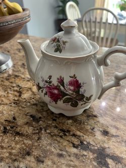 Floral musical porcelain tea pot.