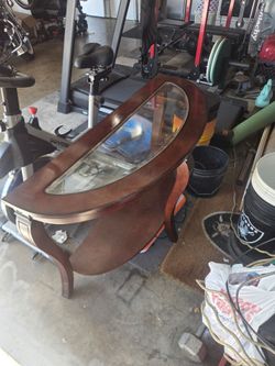 Wooden table with glass top