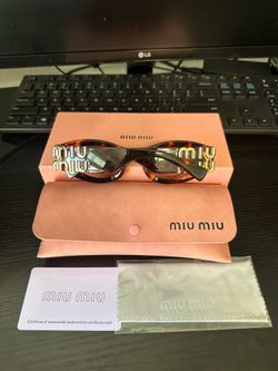 Tortoise miumiu Sunglasses