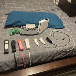 Nintendo Wii with multiple accessories.