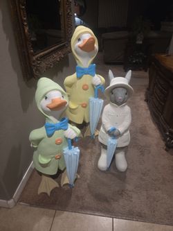 Outdoor plaster ducks and rabbit very very cute and very tall the tallest one is about 4 ft tall