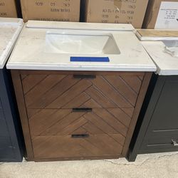 30” Bathroom Vanity in brown , single sink soft close solid wood with vanity top in white  $399  Luke’s liquidations warehouse Address:  2434 N Forsyt