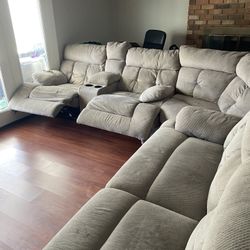 Three piece sectional with reclining sections