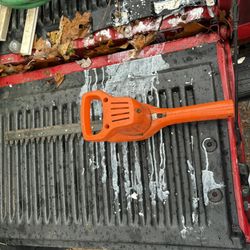 BLACK+DECKER corded electric hedge trimmer.