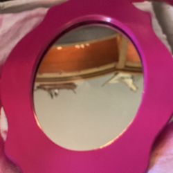 Hot pink, hanging a mirror