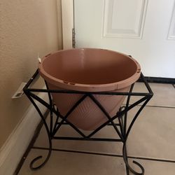 Handmade metal stand with a pot