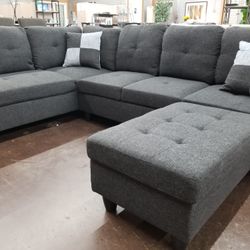 Gray sectional with a matching storage ottoman