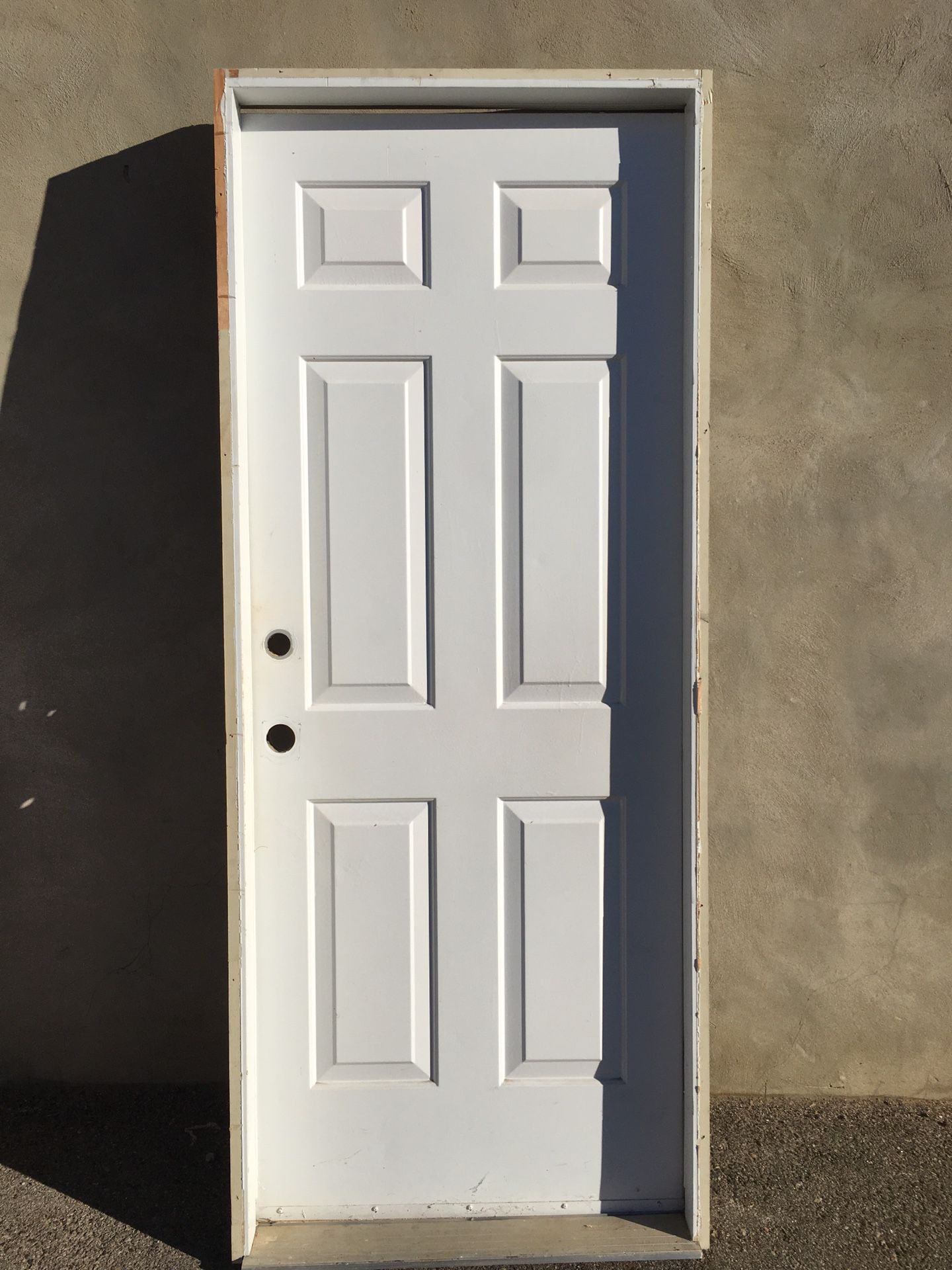 Metal garage door with jamb