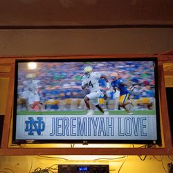 32" LG TV with a swivel mount.