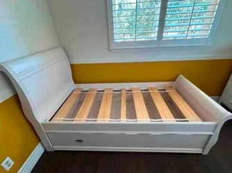 Solid White Twin Sleigh Bed & Trundle Drawer – Needs Minor Repair $59 OB  Clearing space.    First reasonable offer takes It.