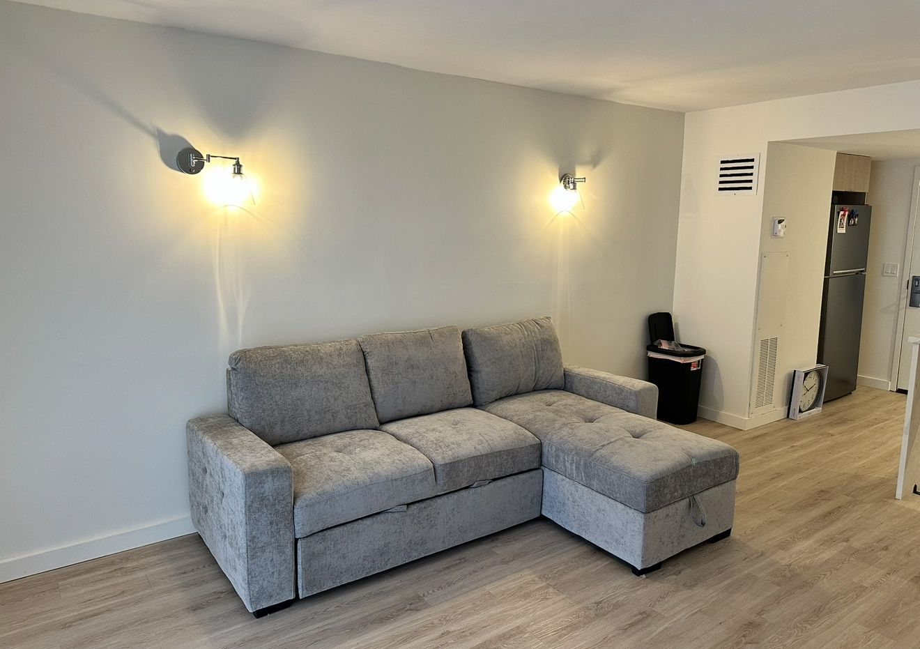 Like New Gray L-Shaped Couch With Storage, Cupholders, and Turns Into a Bed