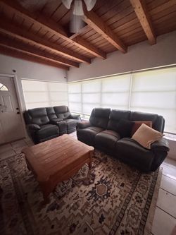 Dark Leather Reclining Sofa and Loveseat Set