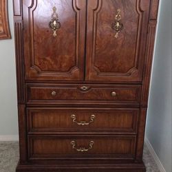 Thomasville Solid wood armoire with 4 drawers. Measures: L40.5" x W 18" x H 78".