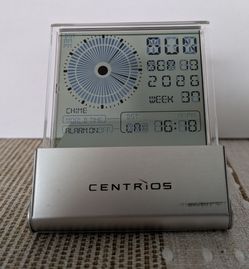 Centrios silver metal collapsible travel clock with a dual analog-digital LCD screen display