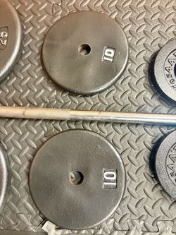 48 inches Steel Standard Barbell W/Weight Plates: 25s, 10s and 5s ponders. 93 # Brute W.