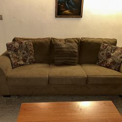 Couch and love seat with pillows also comes with dining table