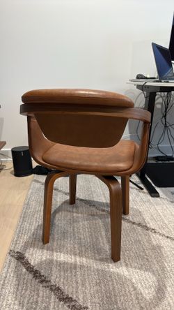 Brown, leather swivel office chair