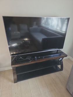 TCL 60 inch TV and stand