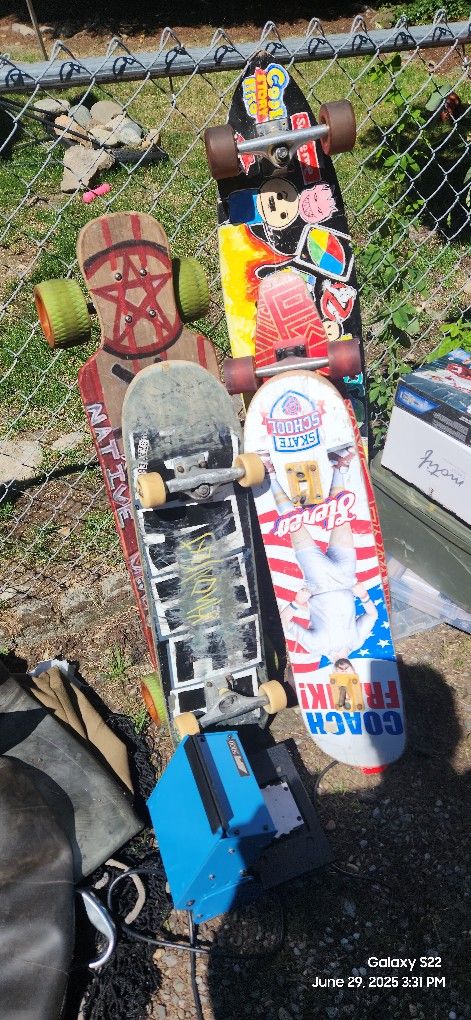 Multiple Long Boards And Skateboards 