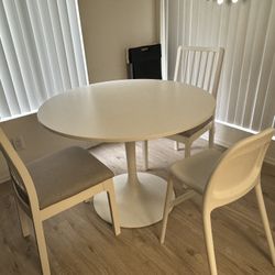 IKEA dining table and two dining chairs
