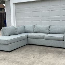 Free Delivery/ Sectional Sofa by Living Spaces 