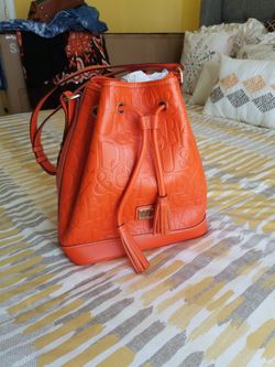 Price Is Negotiable. Orange Dooney & Bourke Monogrammed Embossed Drawstring Bag