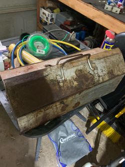 This is a vintage metal tool box, likely produced by a brand such as Kennedy, RemLine, or Craftsman, featuring a weathered patina and significant surf