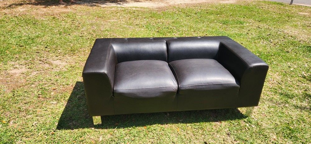 Black modern style leather couch very comfy cushions attached