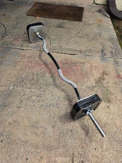 Weight Ironmaster curl bar with plates