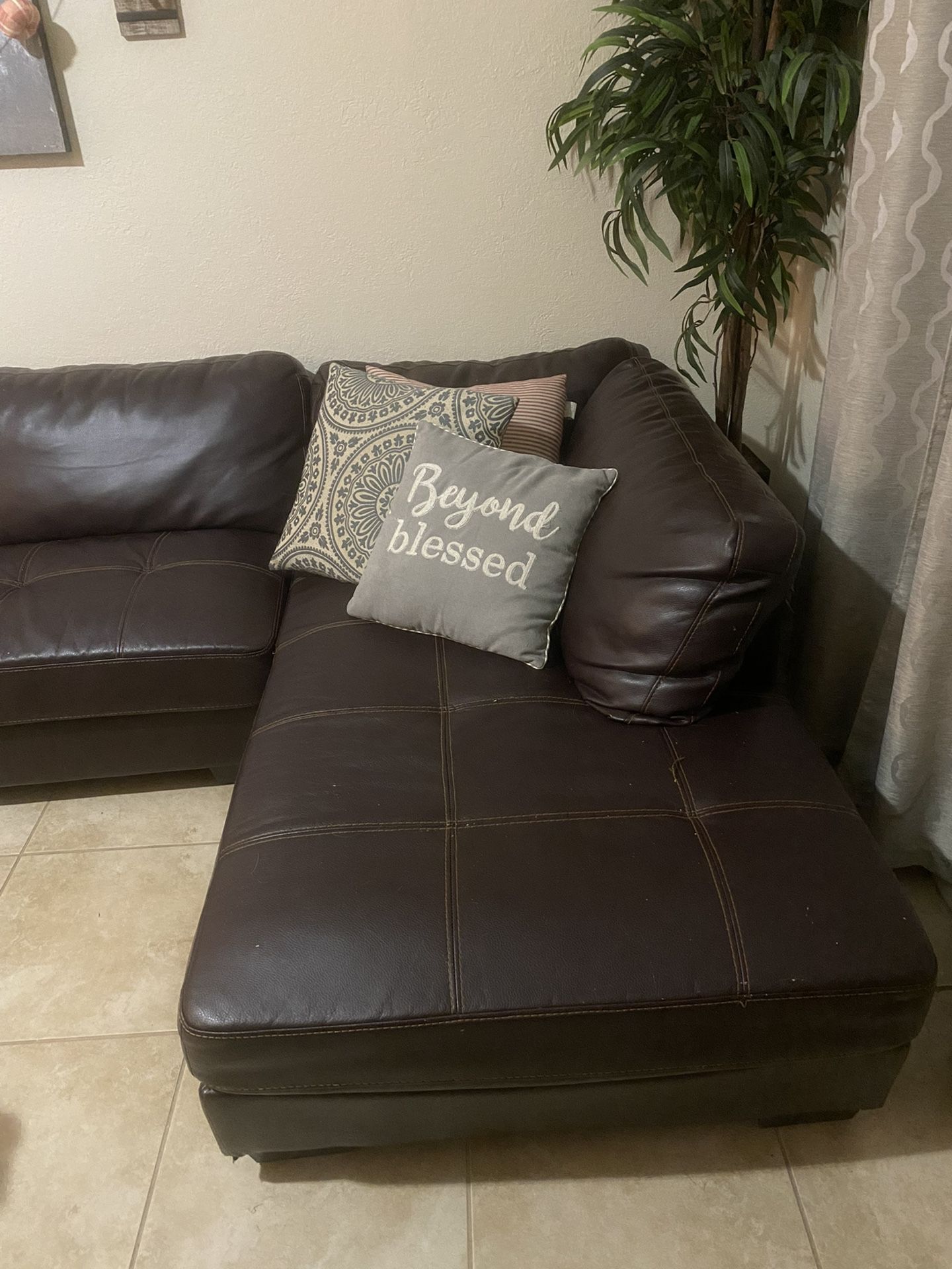 Dark brown sectional and reclining chair