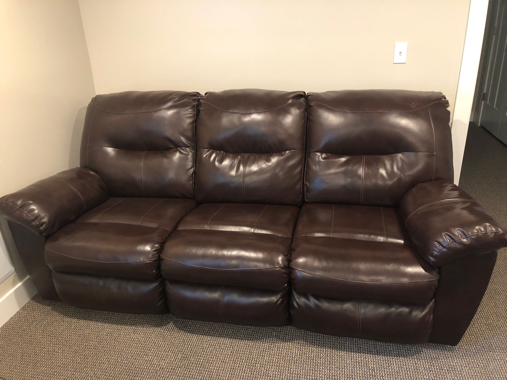 Gently used leather 3-seater couch purchased from RC Willey.