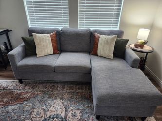 Living Spaces sectional with reversible chaise and Swivel chair