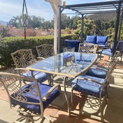Tan Wrought Iron Glass Top Patio Table with 6 Chairs. 