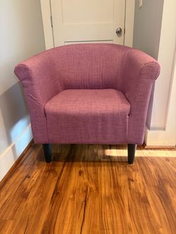 Upholstered armchair.