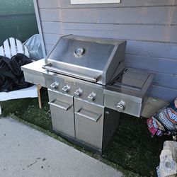 KitchenAid 4-Burner Gas Grill with a side burner and stainless steel construction., well maintained, No Tank, brand new cover