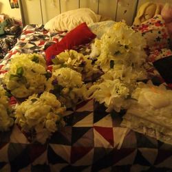 Several Flowers That Never Got Used For A Wedding And The Wedding Photo Book