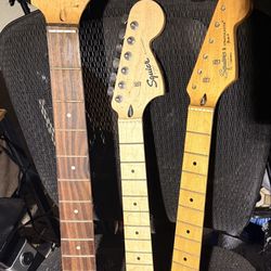 Few guitar necks and a bass neck