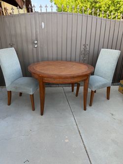Round Wood Dining Table with 2 Upholstered Chairs