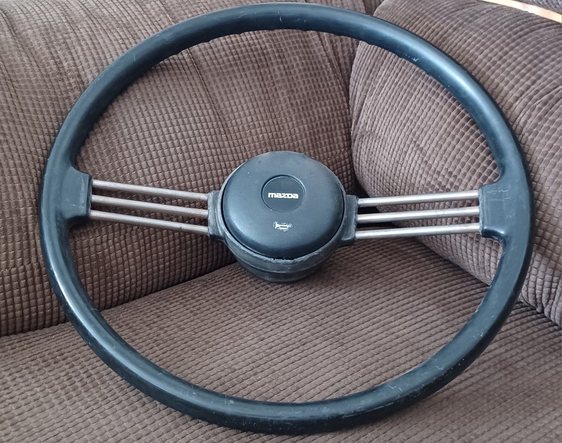 Mazda 2-spoke banjo style steering wheel 