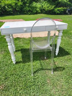 Desk with chair can use a coat of the paint otherwise it's in good shape