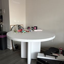 Large white round dining table