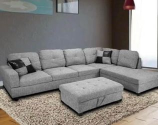 Gray linen sectional couch and ottoman
