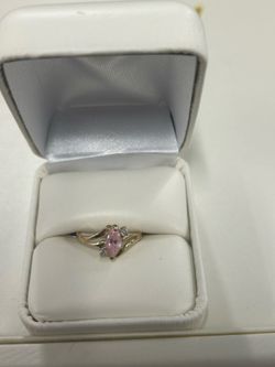 Gold ring with pink stone and diamonds